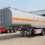 Silver tanker trailer parked in the factory yard