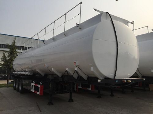 Front view of a white cylindrical tanker trailer