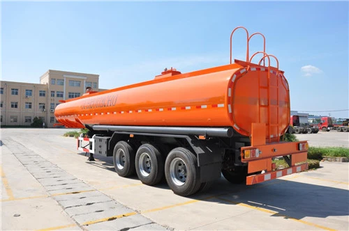Orange tanker trailer viewed from the rear side