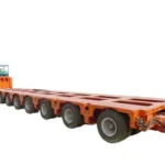 Orange multi-axle low platform trailer