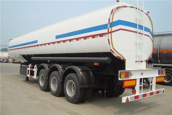 White tanker with blue and red stripes viewed from the rear side