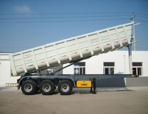 White dump trailer with the cargo body raised