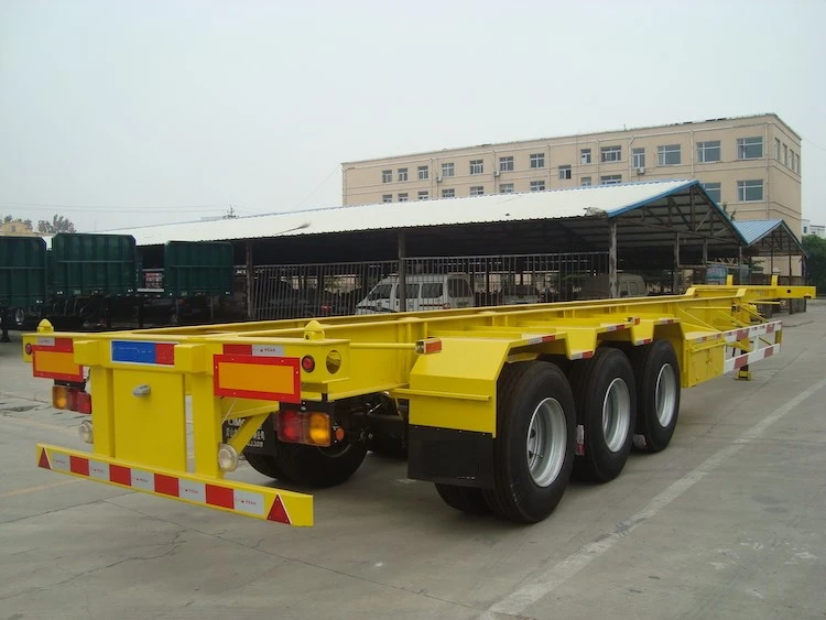 Yellow skeletal container chassis with three axles