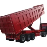 Red rear-dump trailer with the body raised