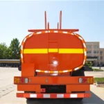 Rear view of an orange tanker trailer