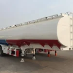 White tanker trailer viewed from the front side