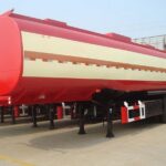 Red and cream tanker trailer outside a workshop