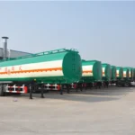 Green and cream tanker trailers in the factory yard