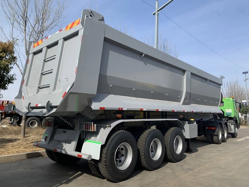 U shape rear dump trailer has the characteristics of flexible steering, large carrying capacity, and the ability to self loading and unloading goods. Dump trailers are of a special type of vehicle that drives the hydraulic lifting mechanism by relying on its own power. It enables the container the function of automatic dumping and reset. Though, this type of trailer cannot load and unload materials by itself in the process of transportation in the plant. In order to accomplish a complete loading, transporting, and unloading process of soil, sand, gravel and other bulk materials, it needs other engineering machinery or lifting equipment’s cooperation such as joint operation with excavator, loader, belt conveyer, etc. The loading capacity of rear dump trailer is low when compared to other types of trailers. The rated capacity of a U shape rear dump trailer generally does not exceed 32 tons. U shape rear dump trailer has the characteristics of flexible steering, large carrying capacity, and the ability to self loading and unloading goods. Dump trailers are of a special type of vehicle that drives the hydraulic lifting mechanism by relying on its own power. It enables the container the function of automatic dumping and reset. Though, this type of trailer cannot load and unload materials by itself in the process of transportation in the plant. In order to accomplish a complete loading, transporting, and unloading process of soil, sand, gravel and other bulk materials, it needs other engineering machinery or lifting equipment’s cooperation such as joint operation with excavator, loader, belt conveyer, etc. The loading capacity of rear dump trailer is low when compared to other types of trailers. The rated capacity of a U shape rear dump trailer generally does not exceed 32 tons.