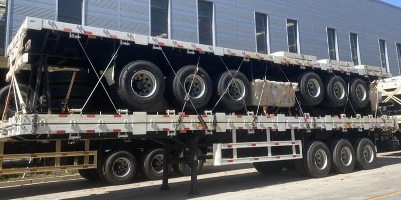Factory produced 3‑axle flatbed semi trailer, heavy‑duty model for container and bulk cargo transport