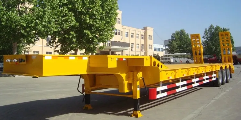 100 ton lowbed semi trailer loading heavy excavator on low platform deck