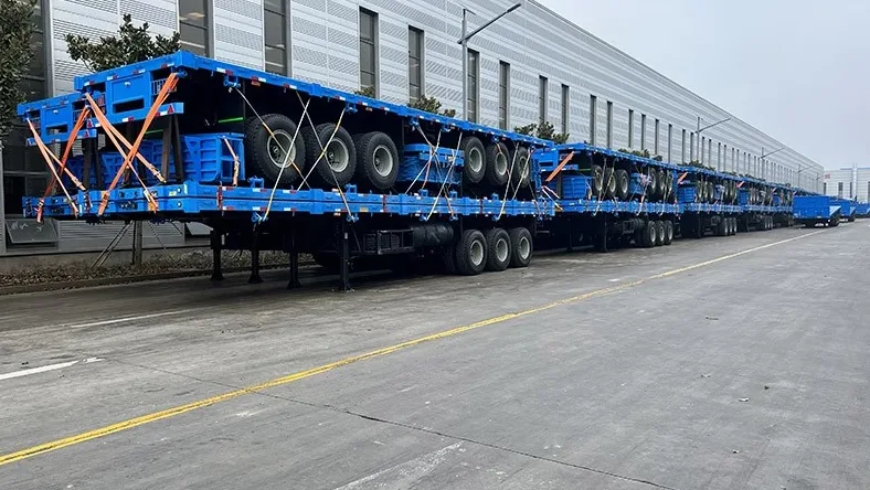 Side wall trailer prepared for shipping with side boards removed and stacked for container transport